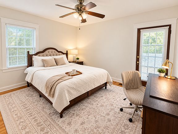 Bright, comfortable bedroom featuring a queen-size memory foam mattress, TV with Netflix Premium, executive desk for remote work, and ultra-fast 1 Gbps internet_thoughtfully designed for restful nights, productive days, and extended stays.