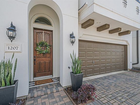 Solid wood door is sure to impress your guests as they arrive.