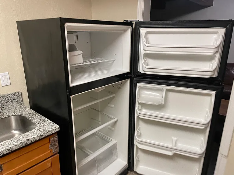 kitchen entrance from kitchen corner, with fridge door open