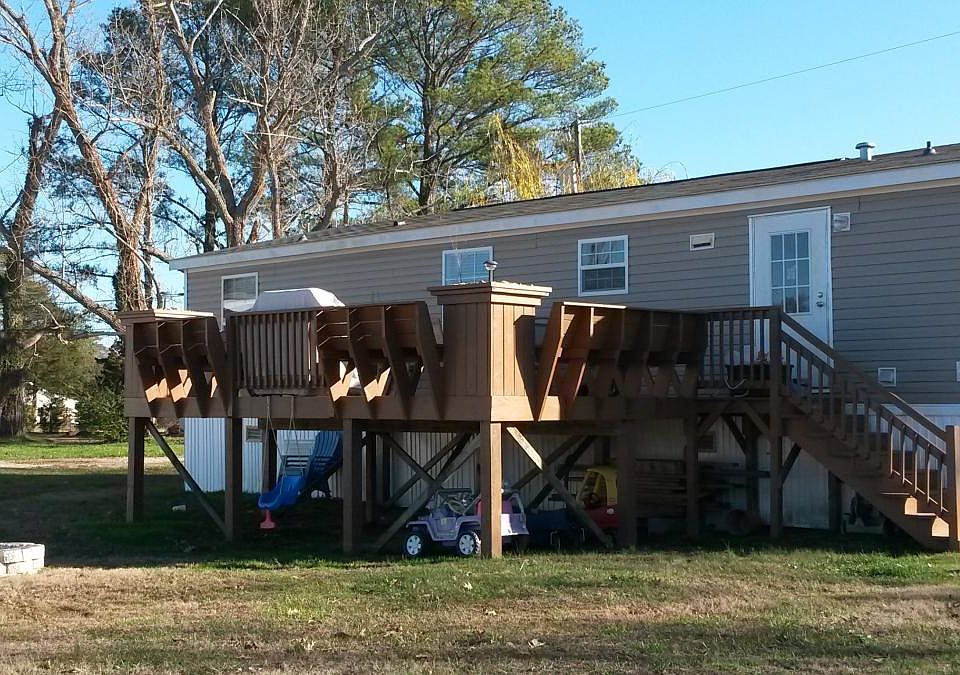 Back door of home facing water.