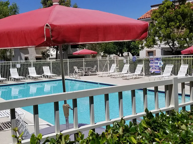 community pool with new tables /chairs