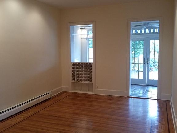 Classic Dining room or family room off kitchen with original hardwood floors and inlaid details