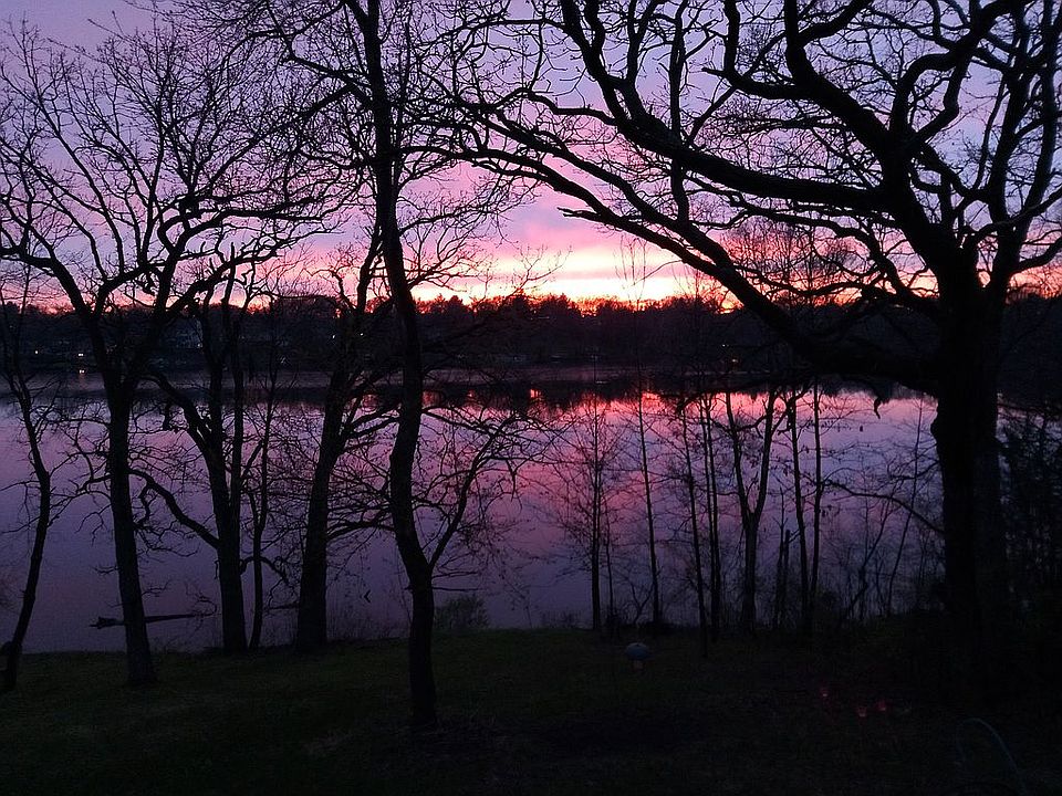 Sun sets over lake