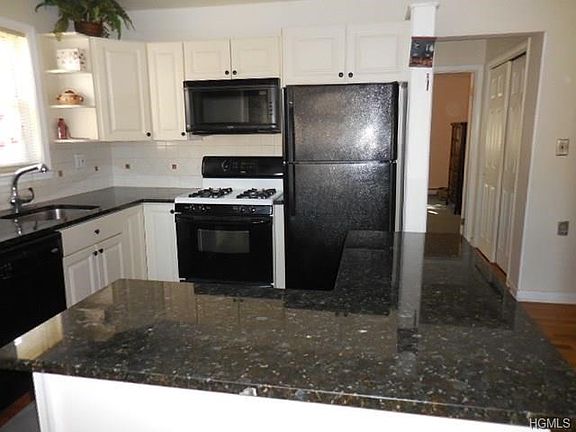 Open concept kitchen yet with lots of cabinets!