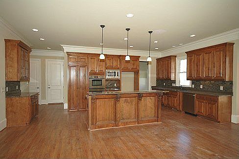 Gourmet kitchen with hidden walk-in pantry