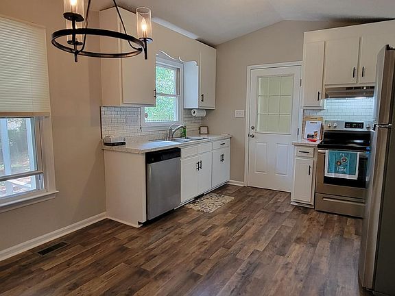 Kitchen with new appliances. best view to trees in the backyard.