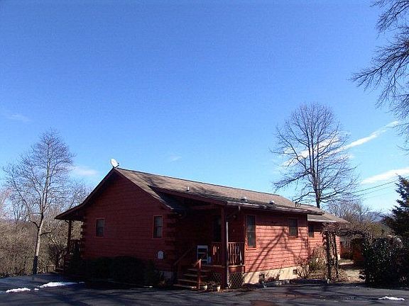 Rear view of home from paved drive
