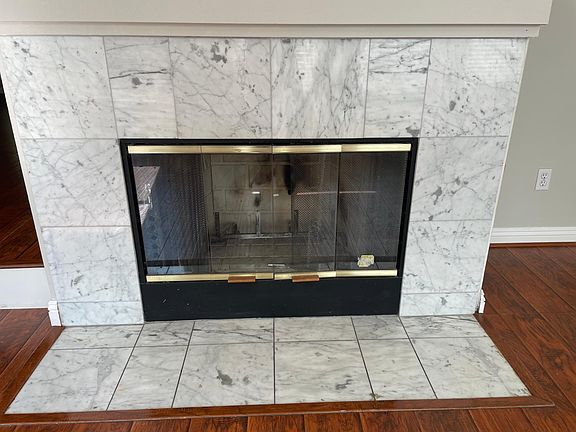 Wood burning Fireplace. Ignites with gas.