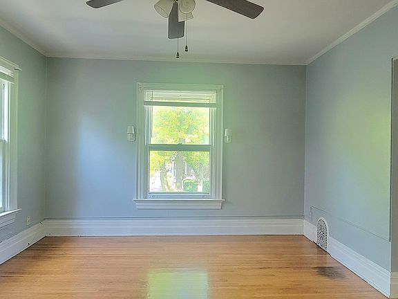 Living room has HW floors and ceiling fan. Lots of natural light!