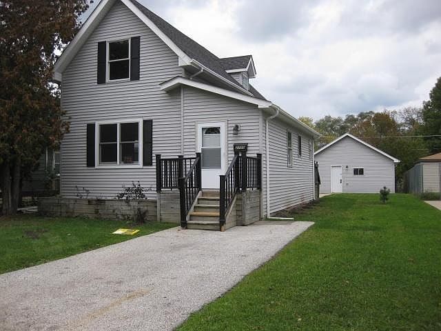 Front of House/ Garage in back