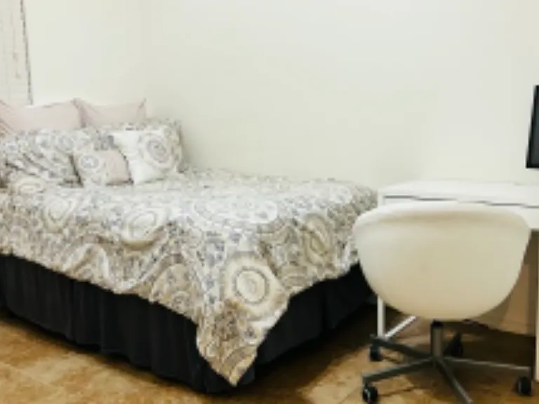 Computer desk with storage, computer chair, full sized bed with under the bed storage that can fit large totes.