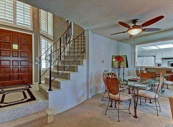 Scraped ceilings, gas fireplace, plantation shutters all enhance