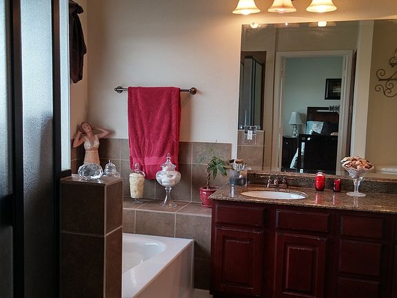Relaxing master bath with a soaker tub, dual sinks, walk in