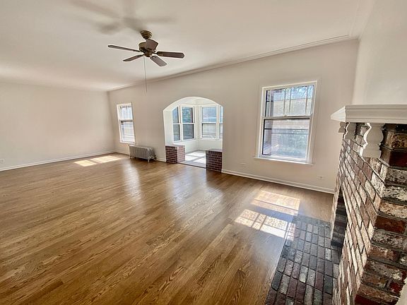 Sprawling LR with decorative FP and beautiful indoor sun parlor