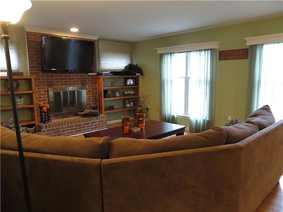 Family room with cozy wood burning fireplace