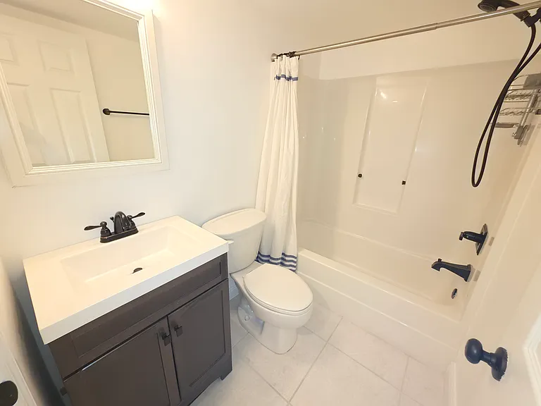 Guest bathroom with tub/shower.