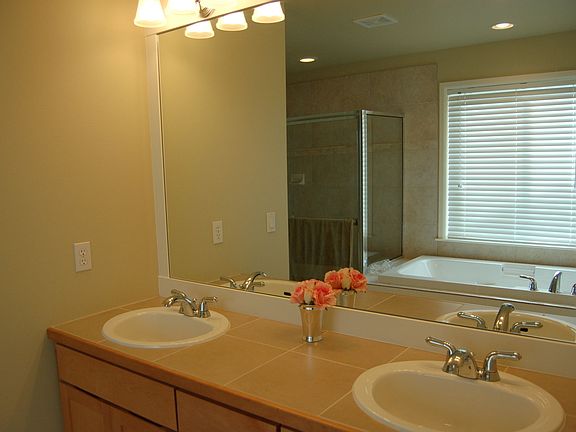 Five-piece bath off master suite includes large soaking tub. Large walk in clo