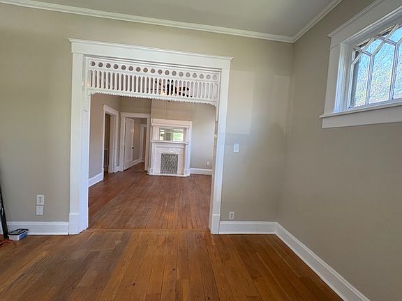 View from the front door. The front door opens into an entry parlor, and living room is straight ahead.