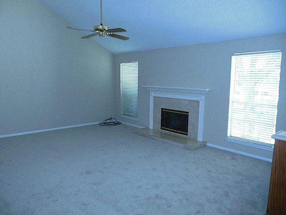 High ceiling large Den with cozy fireplace