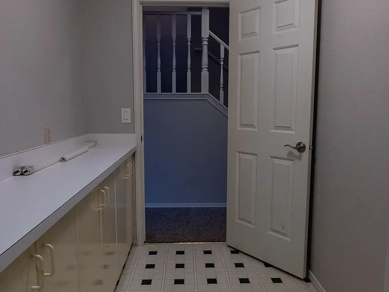 Hallway from laundry / utility room to rest of basement
