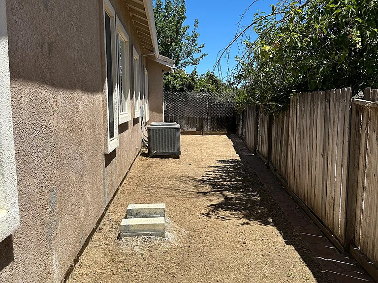 side yard w/ dual AC units