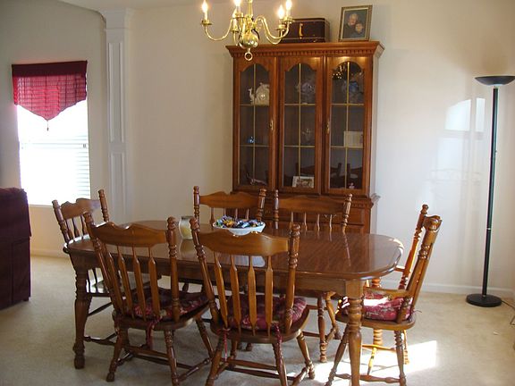 Dining room features trey ceiling. 