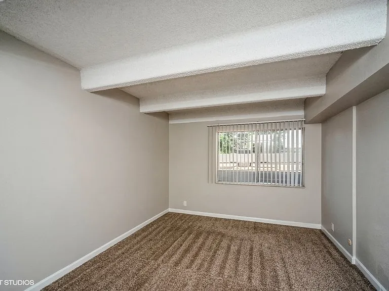 Bedroom with plush carpeting