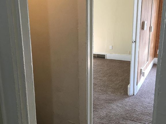 Standing in the kitchen, I'm looking at the top of the stairs, and the living room is on the left, and the office on the right.