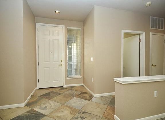 Placed on-point, the look of slate offers timeless appeal, as the tile floors span throughout the living areas.