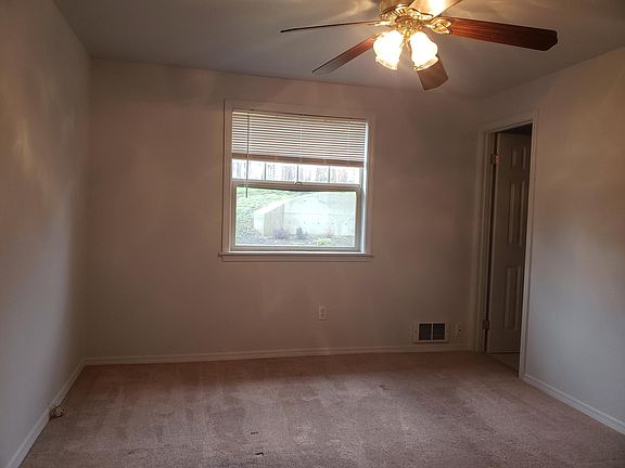 Master Bedroom looks to back yard and has attached private half bath