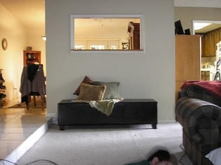 Part of living room looking toward kitchen