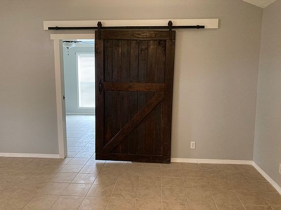 Barn door leading to master bedroom