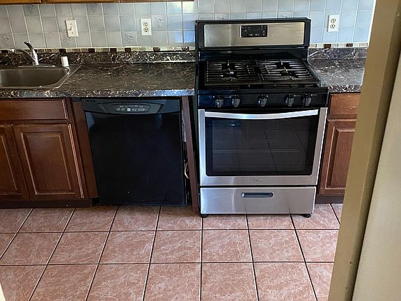kitchen new dishwasher and gas stove