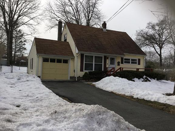 Attractive Cape Cod, set on a Large, Level, Landscaped Property, and Located on a Cul-de-Sac Street.