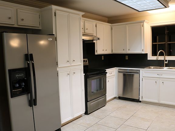 Entrance to house from carport leads to kitchen