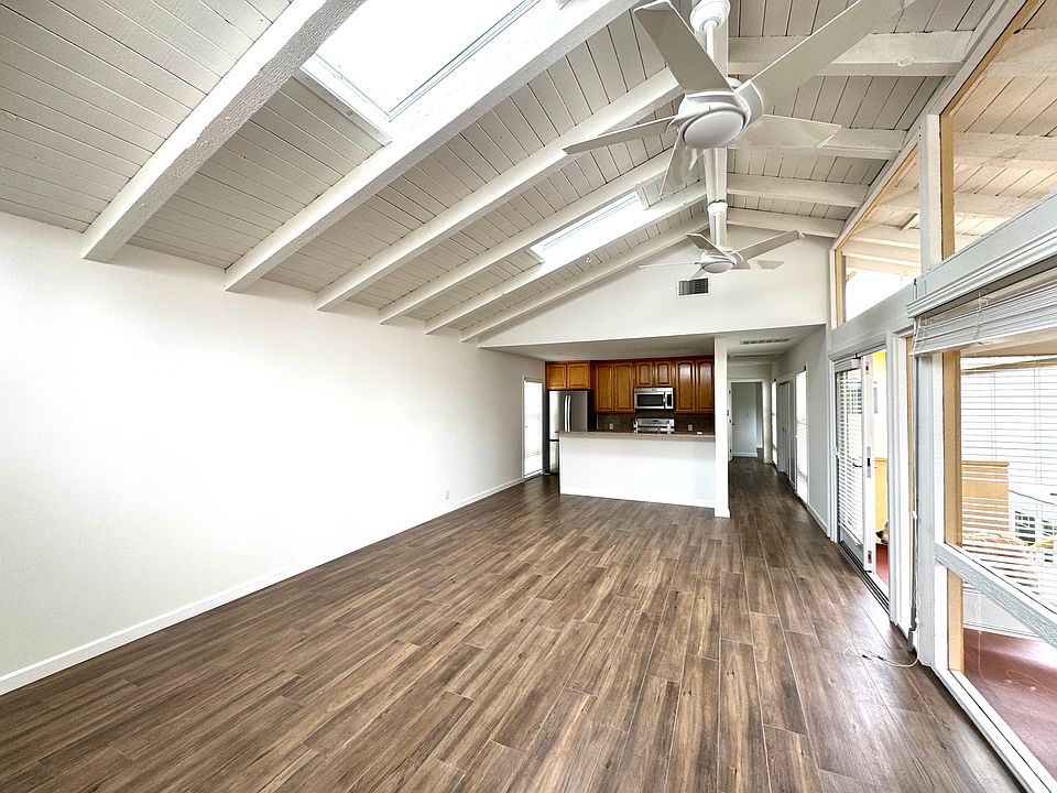 view of living area, kitchen, and hall to other rooms..
