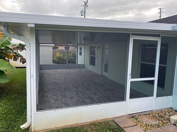Screened back porch with tile floor