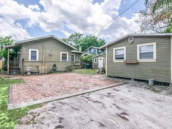 Left unit is the apartment for rent. Private entrance is to left of unit. The smaller structure with the white door is the laundry.