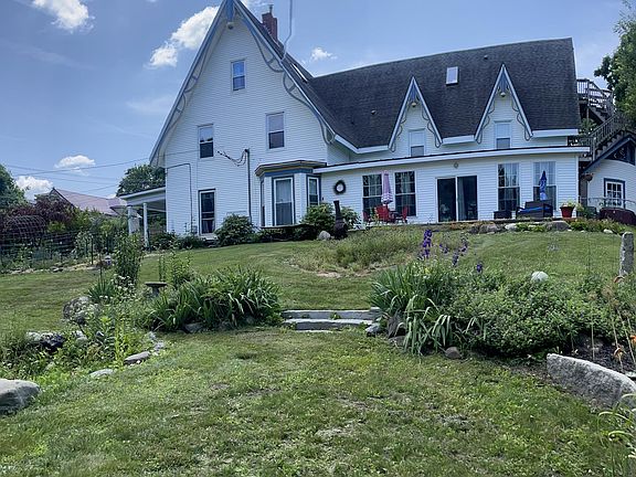 When in full bloom, the views from your kitchen and primary bedroom showcase a beautifully manicured lawn and vibrant garden_creating a serene, picturesque backdrop to your everyday.