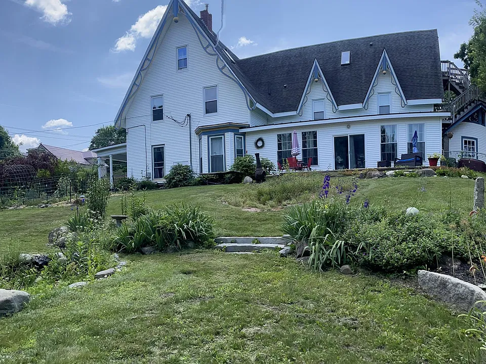 When in full bloom, the views from your kitchen and primary bedroom showcase a beautifully manicured lawn and vibrant garden_creating a serene, picturesque backdrop to your everyday.