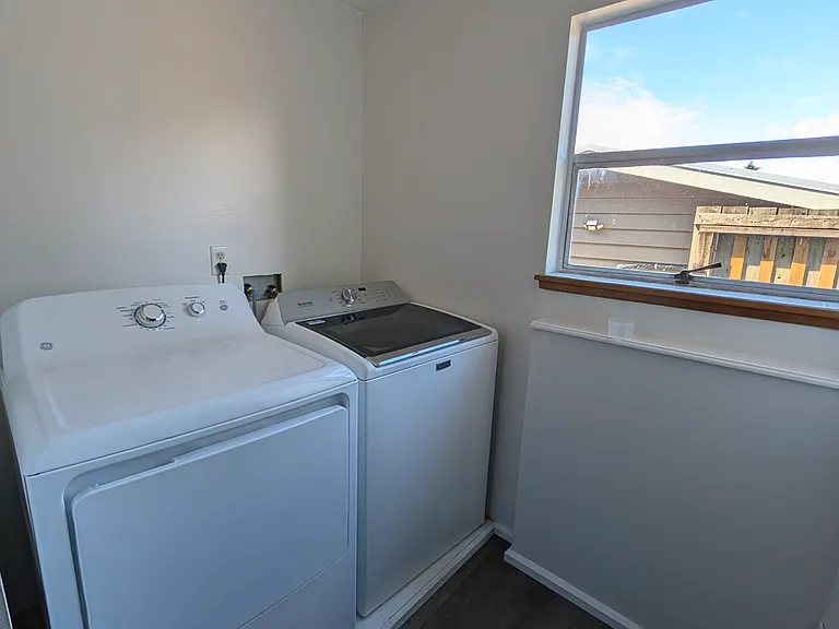 Laundry area is outside the bathroom