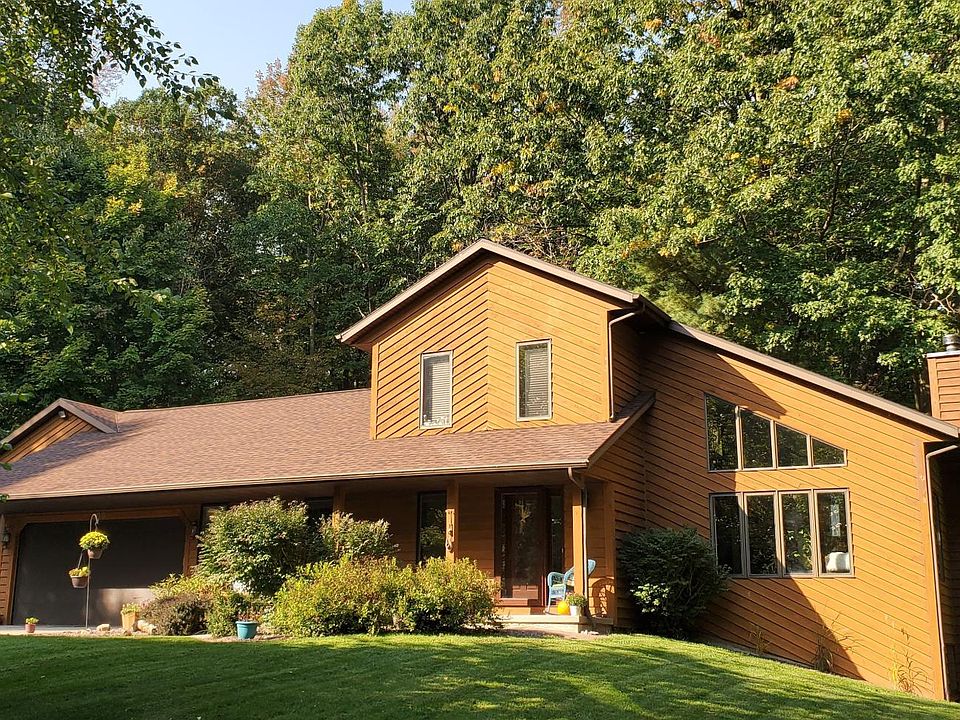 Front view of the home featuring a large covered porch.