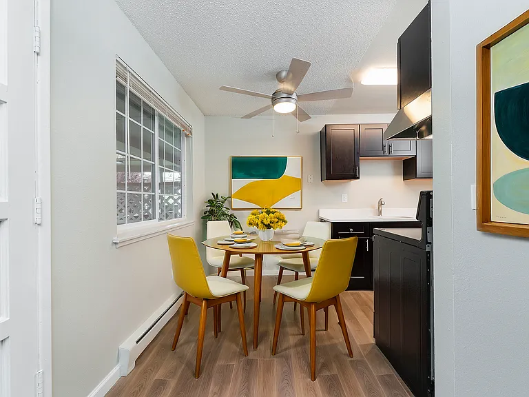 Enjoy meals in a vibrant dining area seamlessly connected to a sleek kitchen.