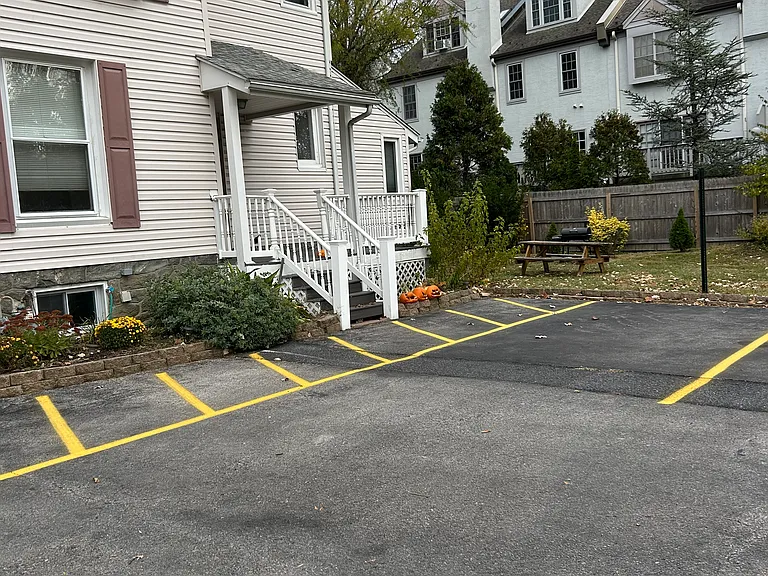 Private off-street parking and a shared outdoor area provide added convenience and space to enjoy the outdoors. Well-maintained grounds with easy access to the property and dedicated parking for residents.