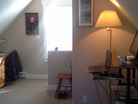 Bedroom facing south, small walk in closet behind lamp.