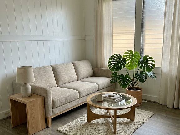 Living room includes window ac unit (photo staged with furniture not included)
