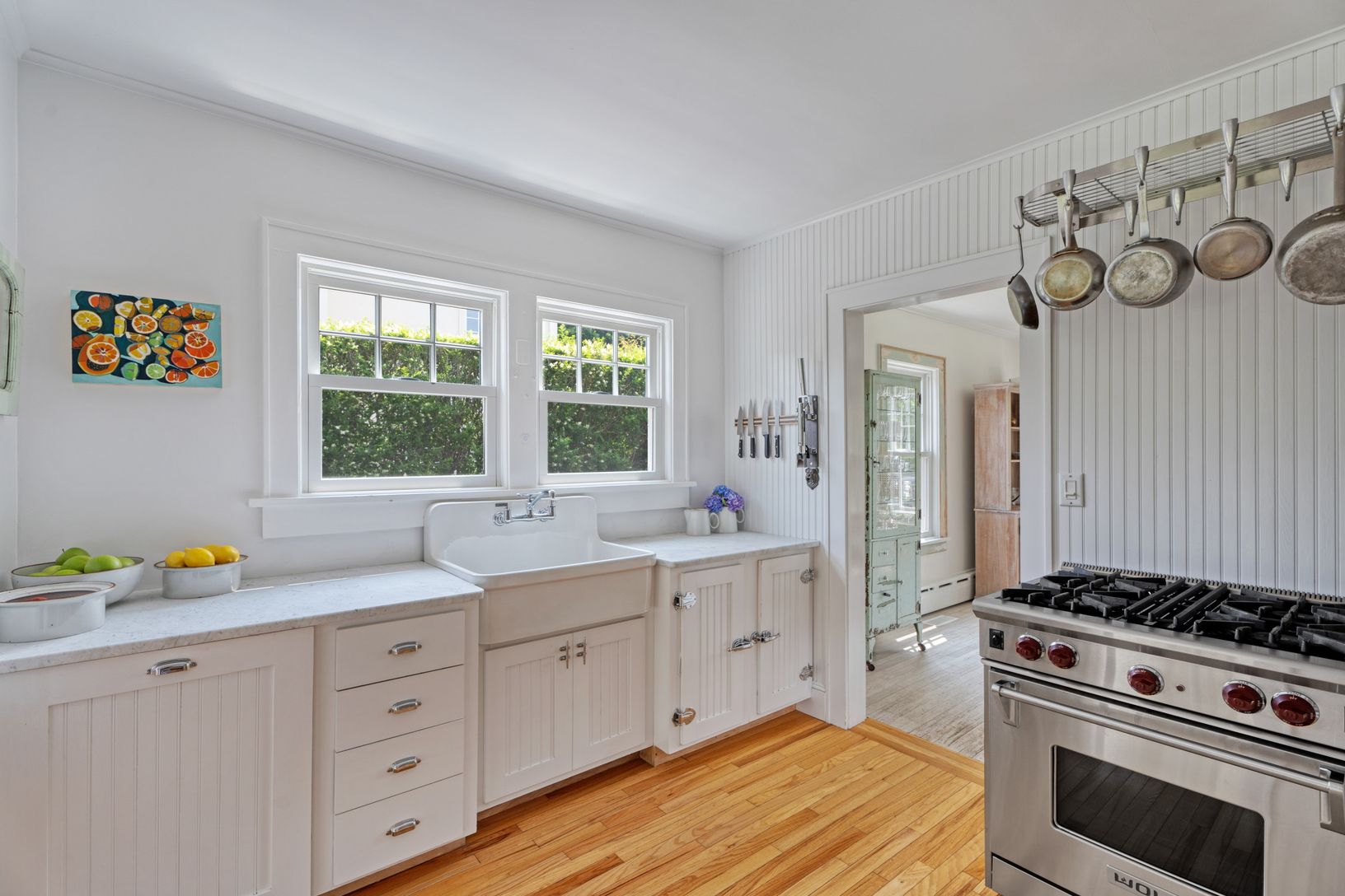 Kitchen with farmhouse sink, Wolf range and Miele dishwasher