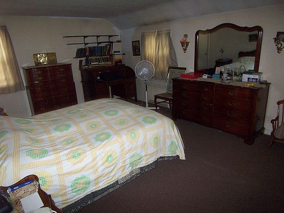 large master bedroom with his & her closets