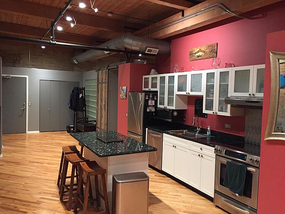 View from kitchen toward entry and master bedroom
