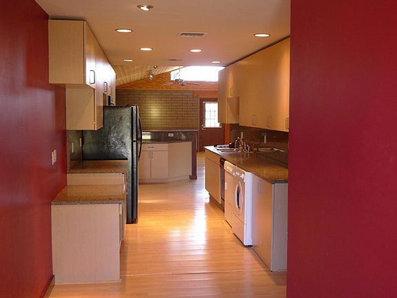 Galley kitchen with washer, dryer, DW, range, cooktop, micro